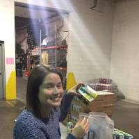 Alumna helps package food
